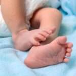 05944020-bigstock-New-Born-Baby-Feet-On-White-Bl-449030203