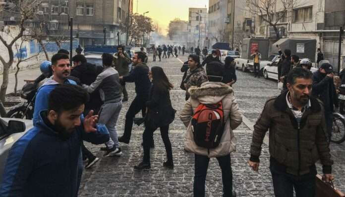 Iran people are affected by tear gas fired by anti riot Iranian police