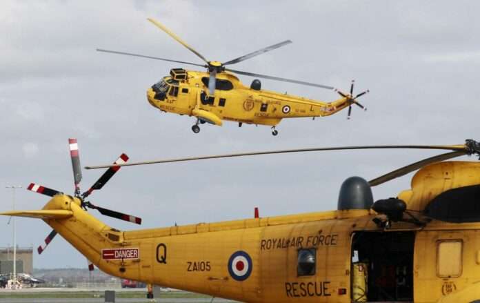 A Sea King search and rescue helicopter lands
