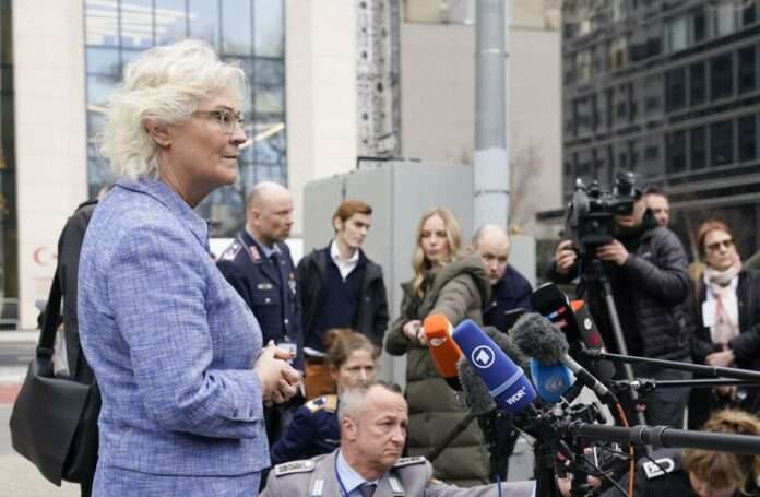 German Minister of Defense Christine Lambrecht speaks to reporters
